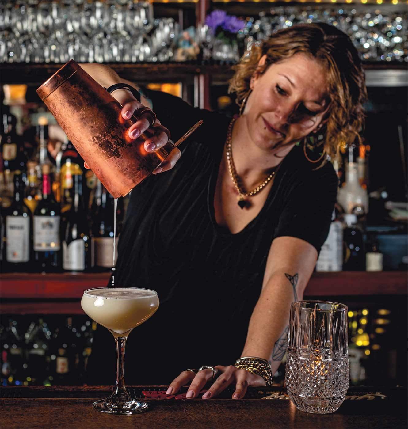 Amanda Whalen pouring a special cocktail.